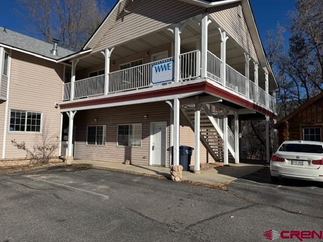 1666 Main Avenue, Unit A Durango, CO 81301 - Photo 11 of 18 a view of a white building with large windows
