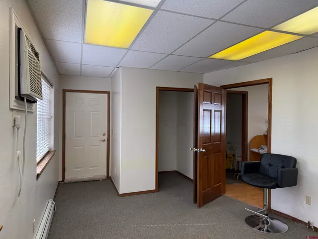 a view of a livingroom with furniture and windows