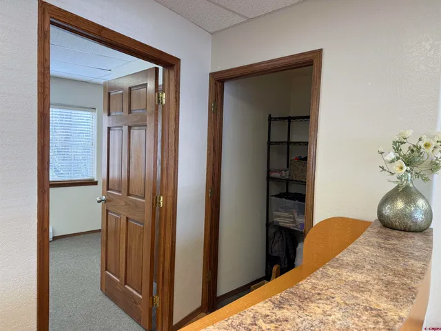 a bathroom with a toilet a sink and a mirror