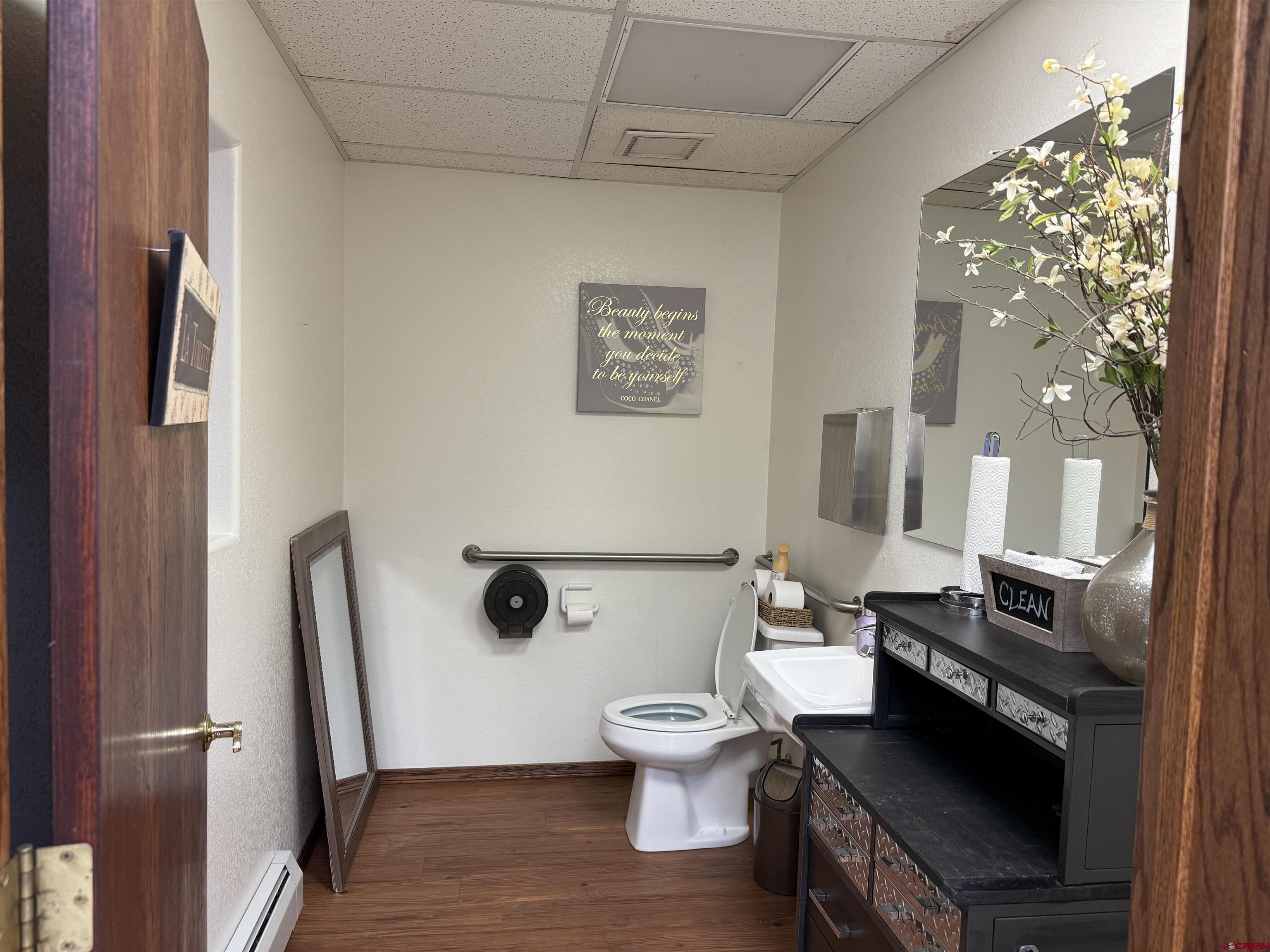 1666 Main Avenue, Unit A Durango, CO 81301 - Photo 17 of 28 a bathroom with a toilet a sink and a mirror