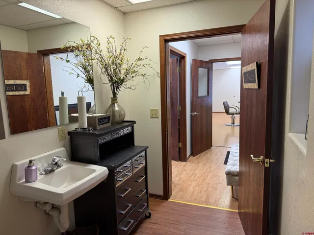 a bathroom with a sink and mirror