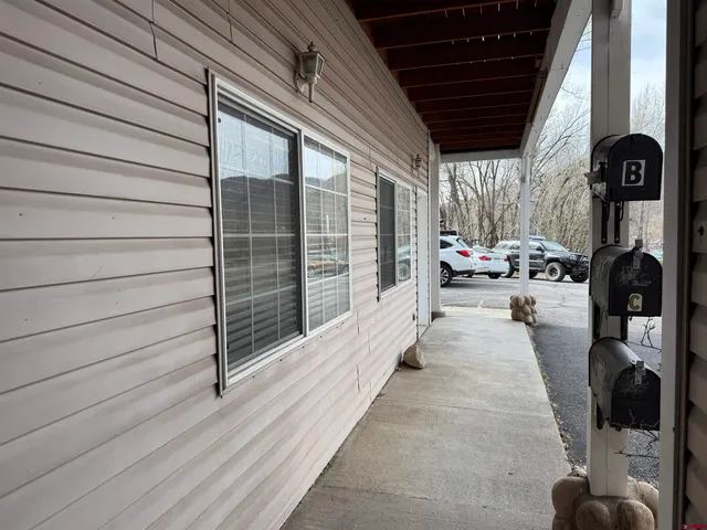 a view of a car parked in front of a house