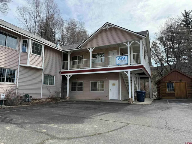 a front view of a house with a garage