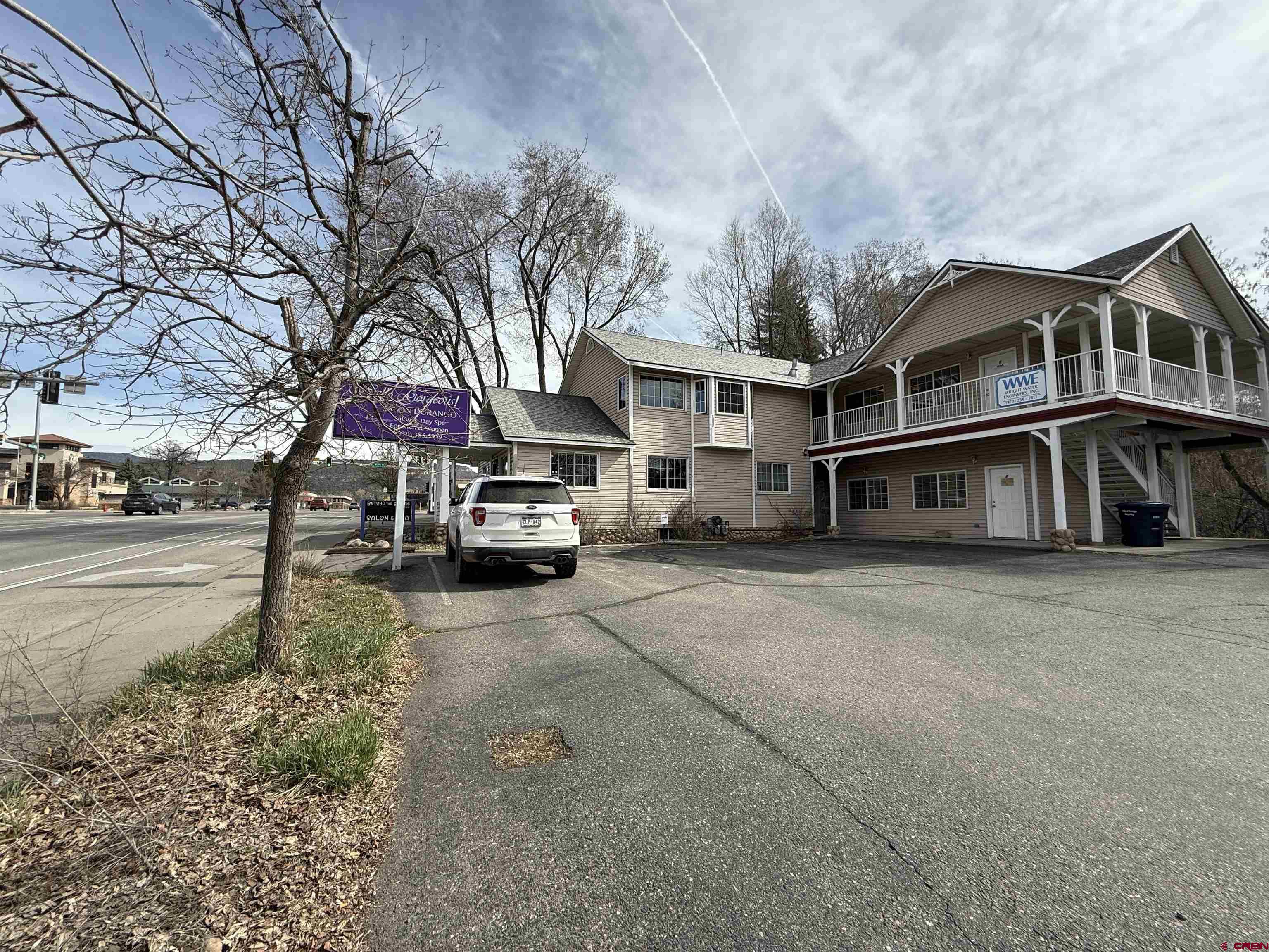 1666 Main Avenue, Unit A Durango, CO 81301 - Photo 10 of 18 a view of a white house next to a road and yard