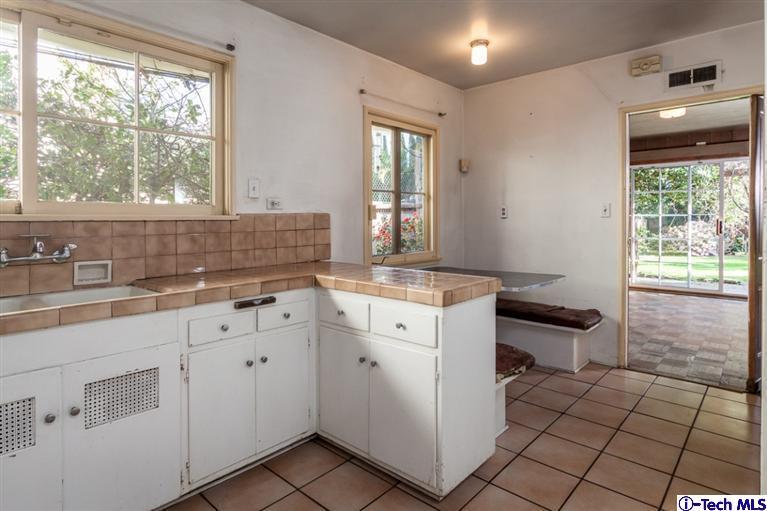2924 Lombardy Road Pasadena, CA 91107 - Photo 12 of 20 a kitchen with sink cabinets and window