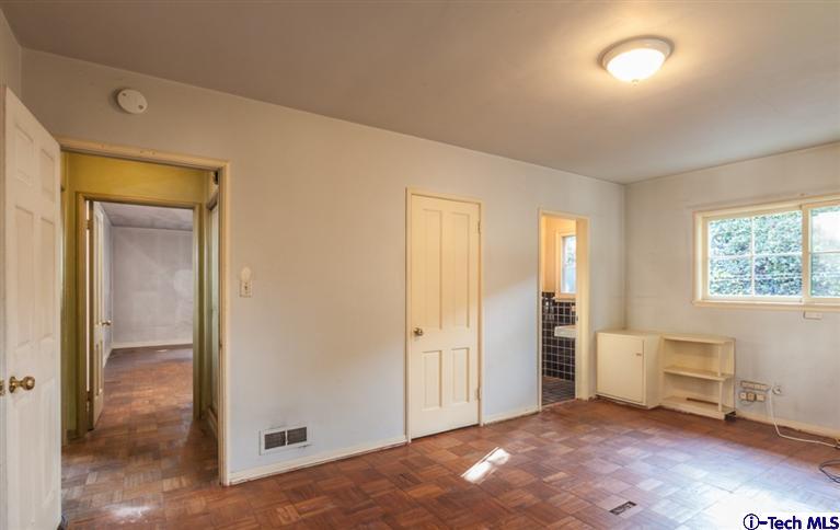 2924 Lombardy Road Pasadena, CA 91107 - Photo 9 of 20 an empty room with windows and closet