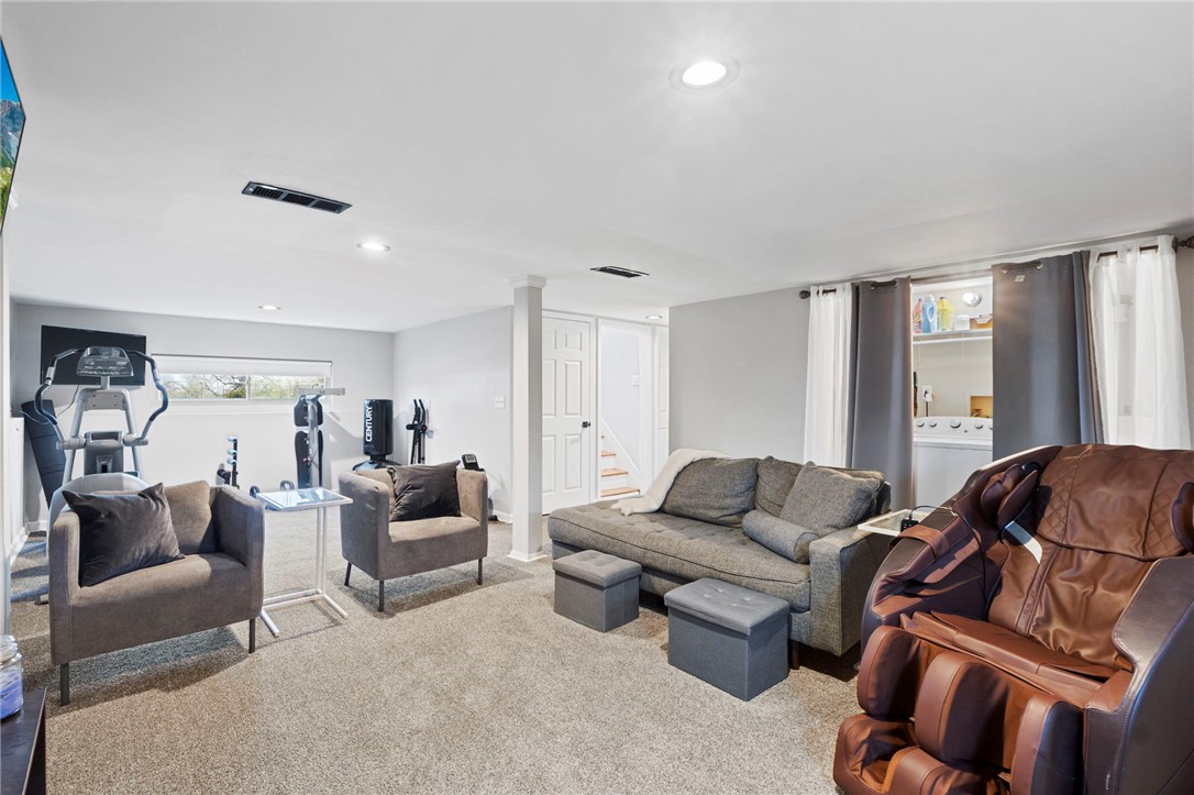 8180 Manning Road Germantown, OH 45327 - Photo 22 of 39 This versatile basement offers a comfortable recreation space and a dedicated area for laundry.