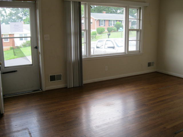 337 Cherryhill Road Northwest Roanoke, VA 24017 - Photo 5 of 14 an empty room with wooden floor and windows