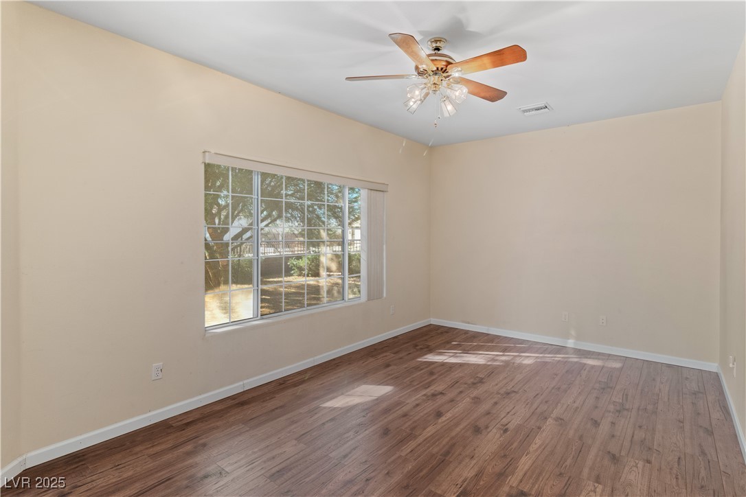 1200 Golf Club Drive Laughlin, NV 89029 - Photo 20 of 87 Den with wood finished floors and ceiling fan