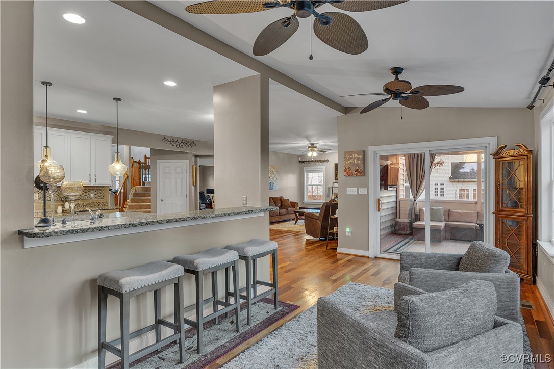14518 Shipborne Road Midlothian, VA 23112 - Photo 12 of 50 a living room with couches chairs and couches with kitchen view