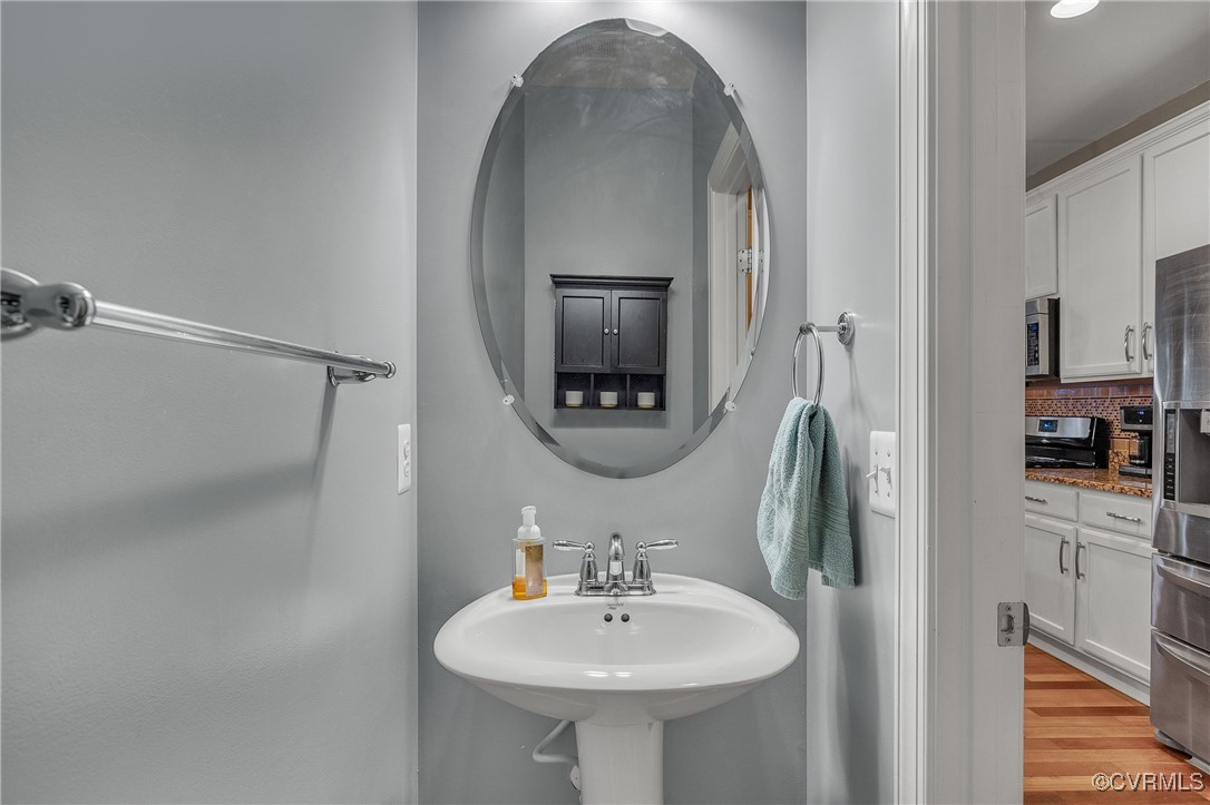 14518 Shipborne Road Midlothian, VA 23112 - Photo 14 of 50 a bathroom with a sink a mirror and shower