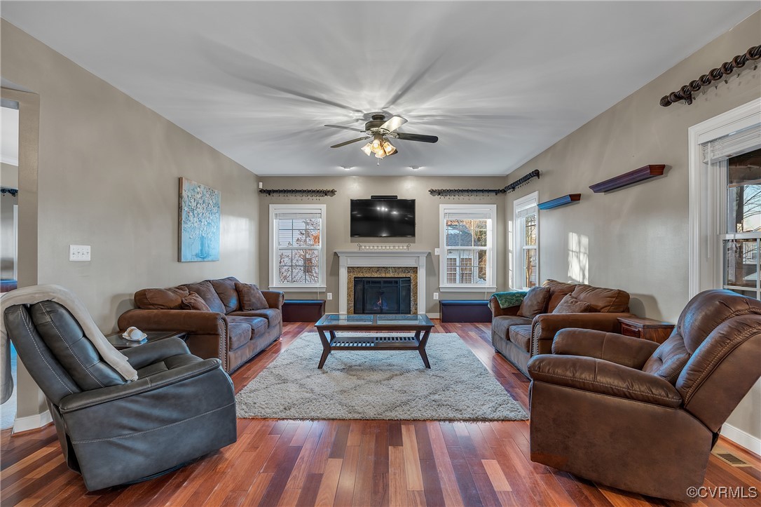14518 Shipborne Road Midlothian, VA 23112 - Photo 3 of 50 a living room with furniture a fireplace and a flat screen tv