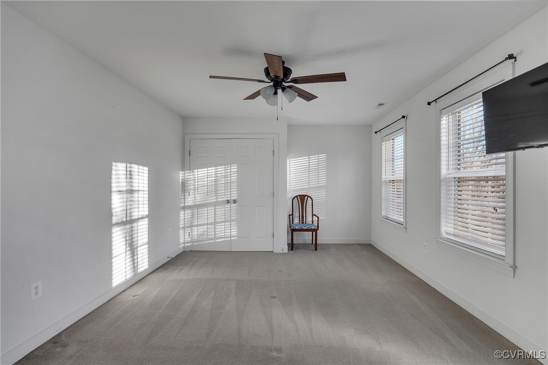 14518 Shipborne Road Midlothian, VA 23112 - Photo 32 of 50 a view of a livingroom with a ceiling fan and window