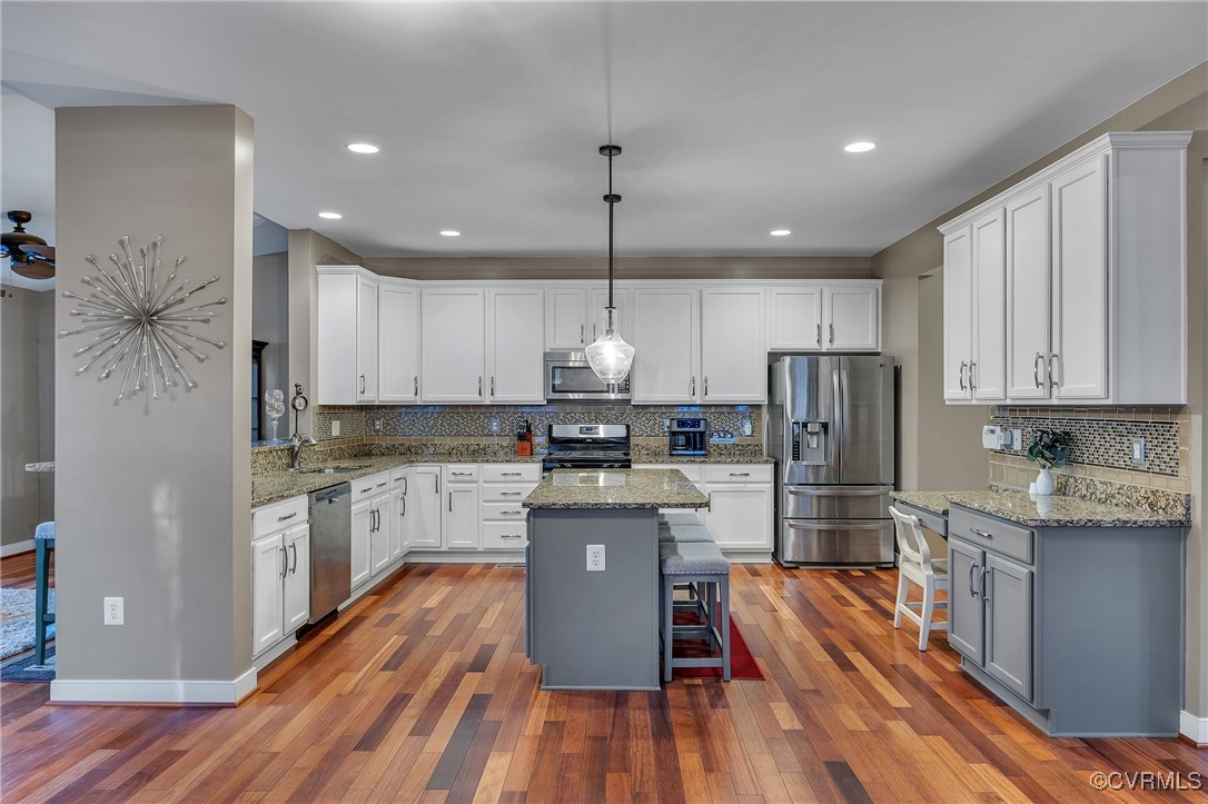 14518 Shipborne Road Midlothian, VA 23112 - Photo 7 of 50 a kitchen with refrigerator cabinets and wooden floor