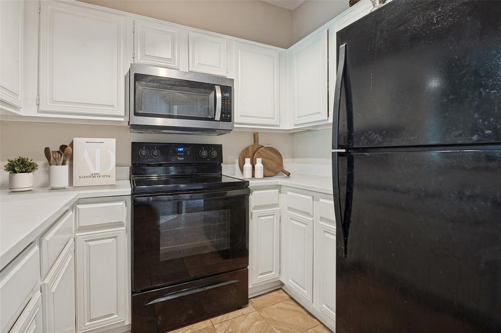 14277 Preston Road, Unit 1012 Dallas, TX 75254 - Photo 3 of 13 Kitchen was recently updated with quartz countertops, fresh paint and a new stainless steel microwave