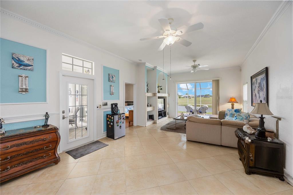 48 Bunker Road Rotonda West, FL 33947 - Photo 11 of 59 a living room with furniture and wooden floor