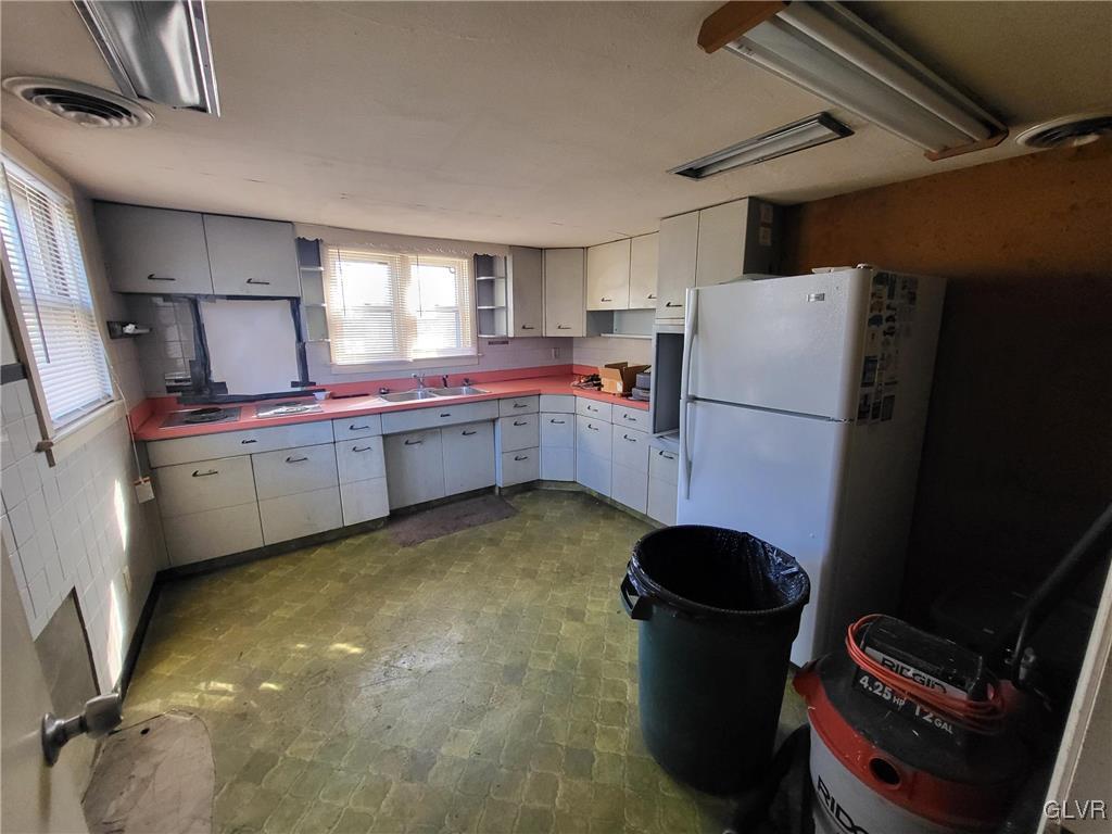 637 5th Street Whitehall, PA 18052 - Photo 11 of 25 a room with refrigerator and washer