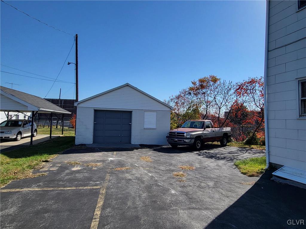 637 5th Street Whitehall, PA 18052 - Photo 21 of 25 a view of a house with a yard and garage