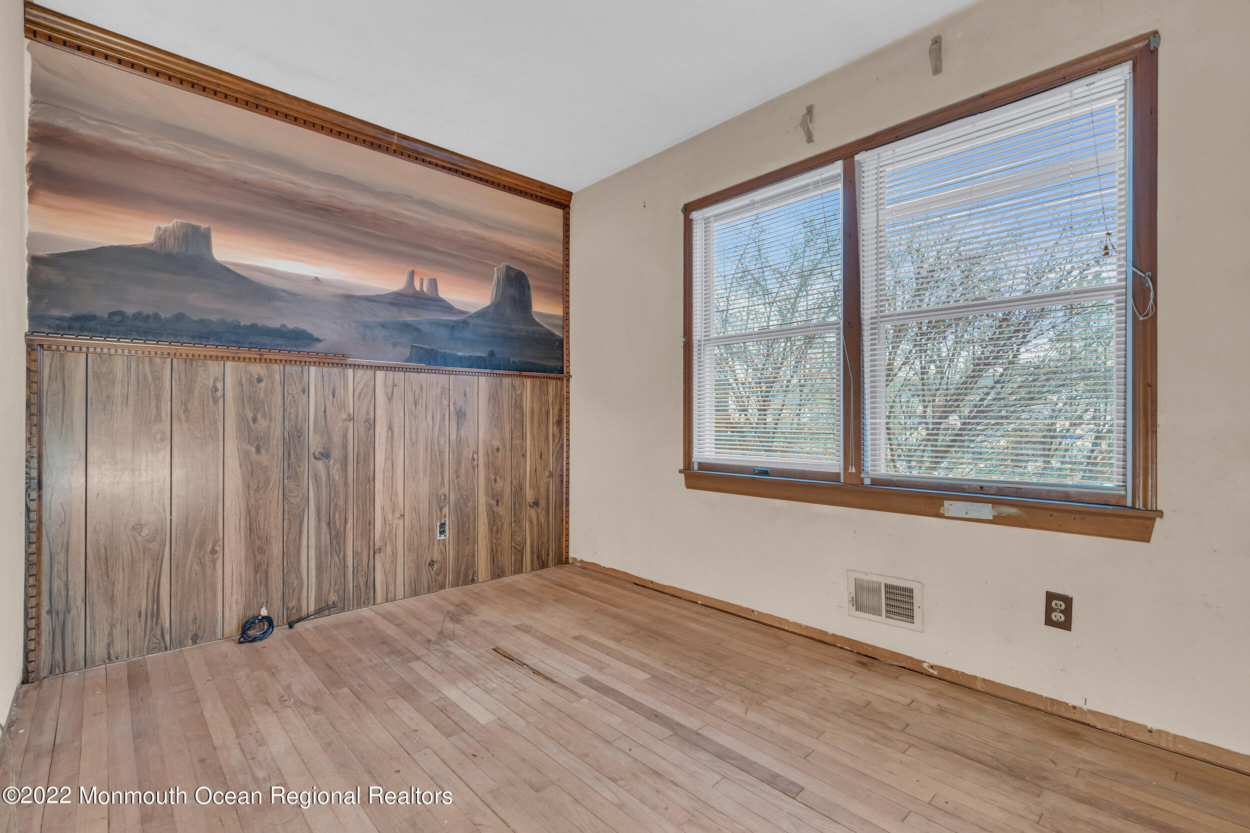 322 Bellanca Road Brick, NJ 08723 - Photo 18 of 23 a view of an empty room with a window and wooden floor