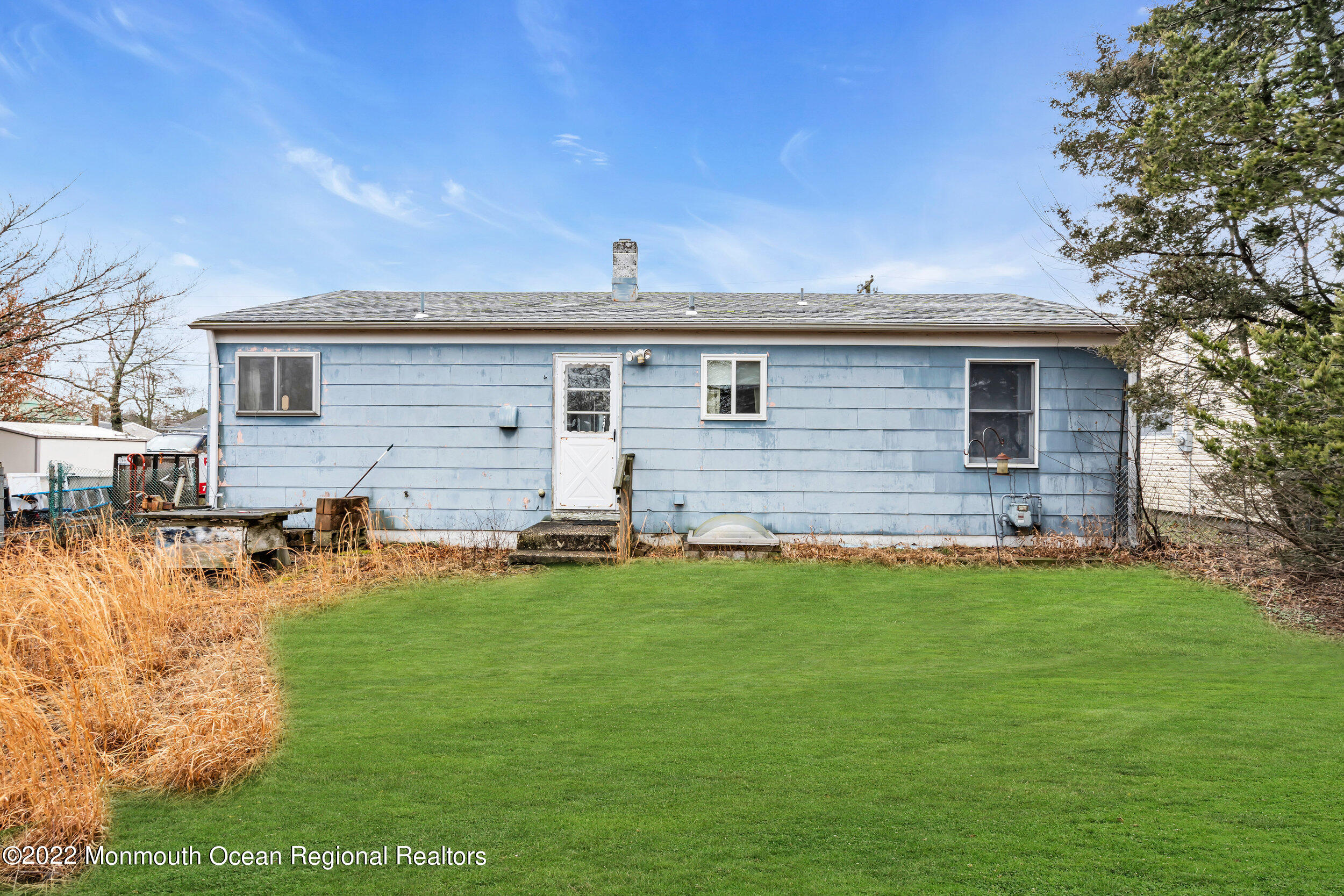 322 Bellanca Road Brick, NJ 08723 - Photo 22 of 23 a backyard of a house with table and chairs