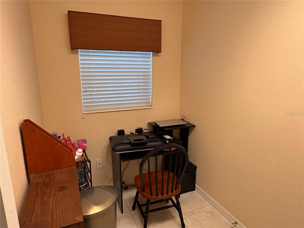 2184 Markridge Loop The Villages, FL 32162 - Photo 13 of 35 a view of a room with a desk and chair