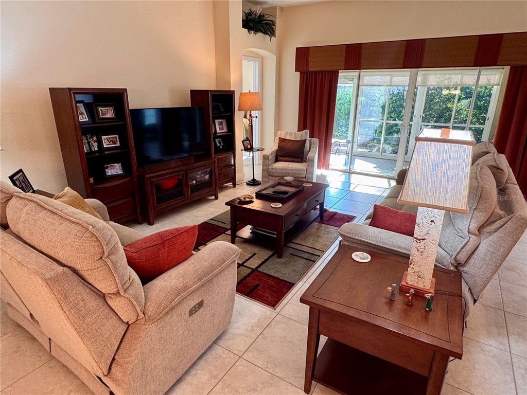 2184 Markridge Loop The Villages, FL 32162 - Photo 16 of 35 a living room with furniture and a flat screen tv