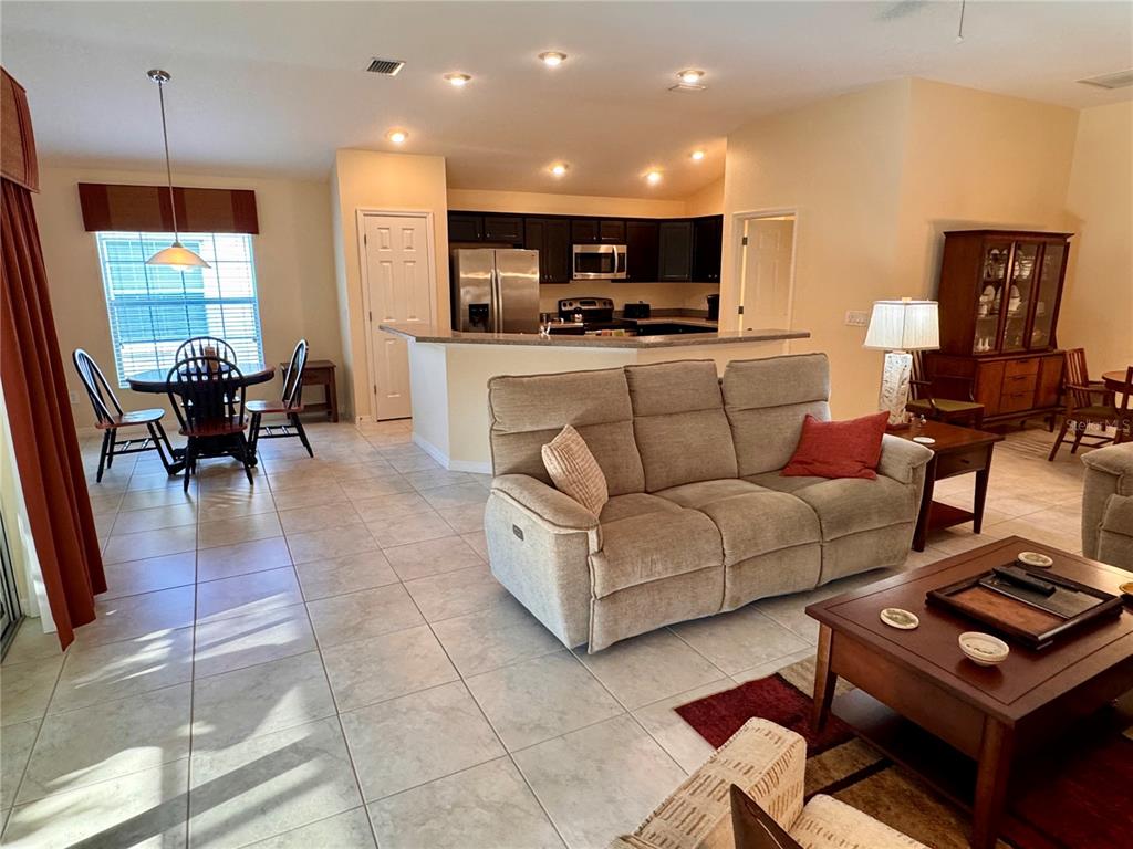 2184 Markridge Loop The Villages, FL 32162 - Photo 17 of 35 a living room with furniture and a flat screen tv