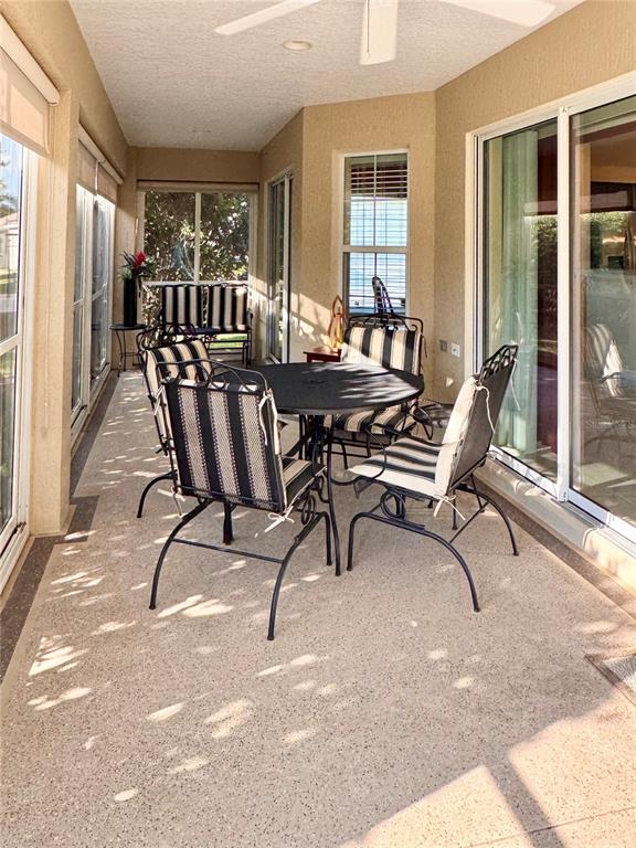 2184 Markridge Loop The Villages, FL 32162 - Photo 19 of 35 a view of a dining room with furniture and windows
