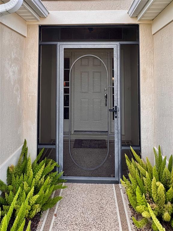 2184 Markridge Loop The Villages, FL 32162 - Photo 2 of 35 a front view of a house with a garden