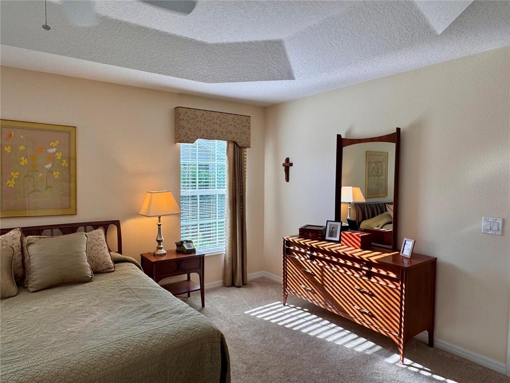 2184 Markridge Loop The Villages, FL 32162 - Photo 22 of 35 a bedroom with bed and window