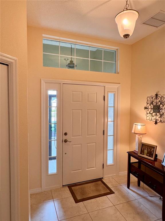 2184 Markridge Loop The Villages, FL 32162 - Photo 28 of 35 a view of front door with wooden floor