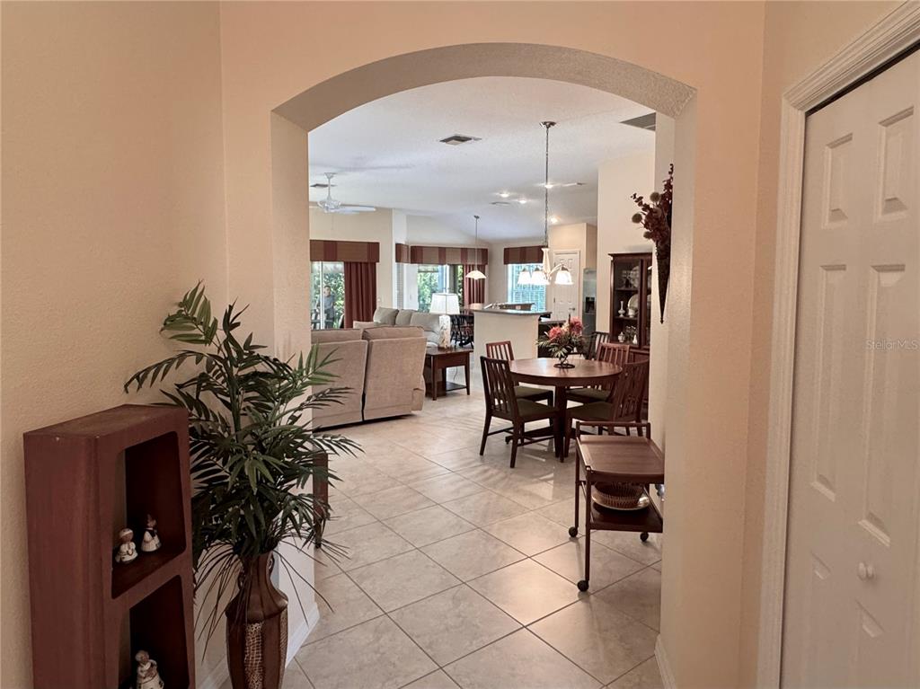 2184 Markridge Loop The Villages, FL 32162 - Photo 3 of 35 a living room with furniture and a potted plant