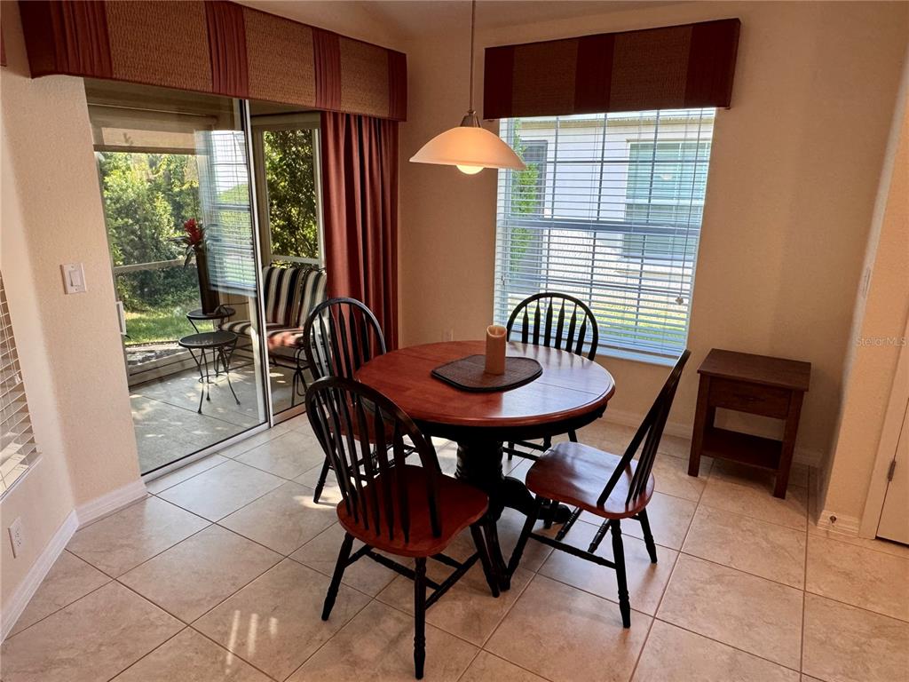 2184 Markridge Loop The Villages, FL 32162 - Photo 9 of 35 a dining room with furniture and window