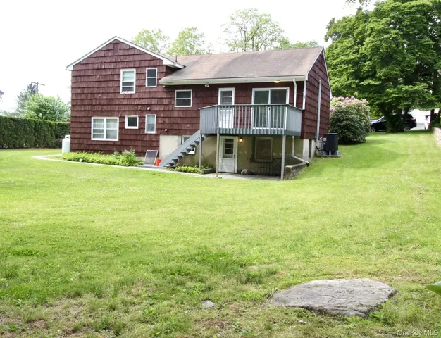 a view of a house with a backyard