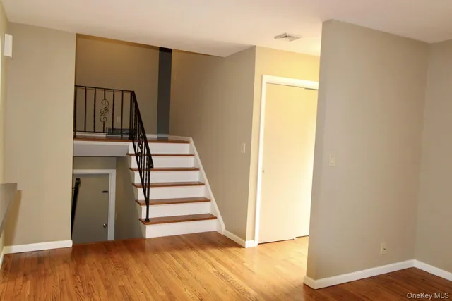 a view of entryway with wooden floor