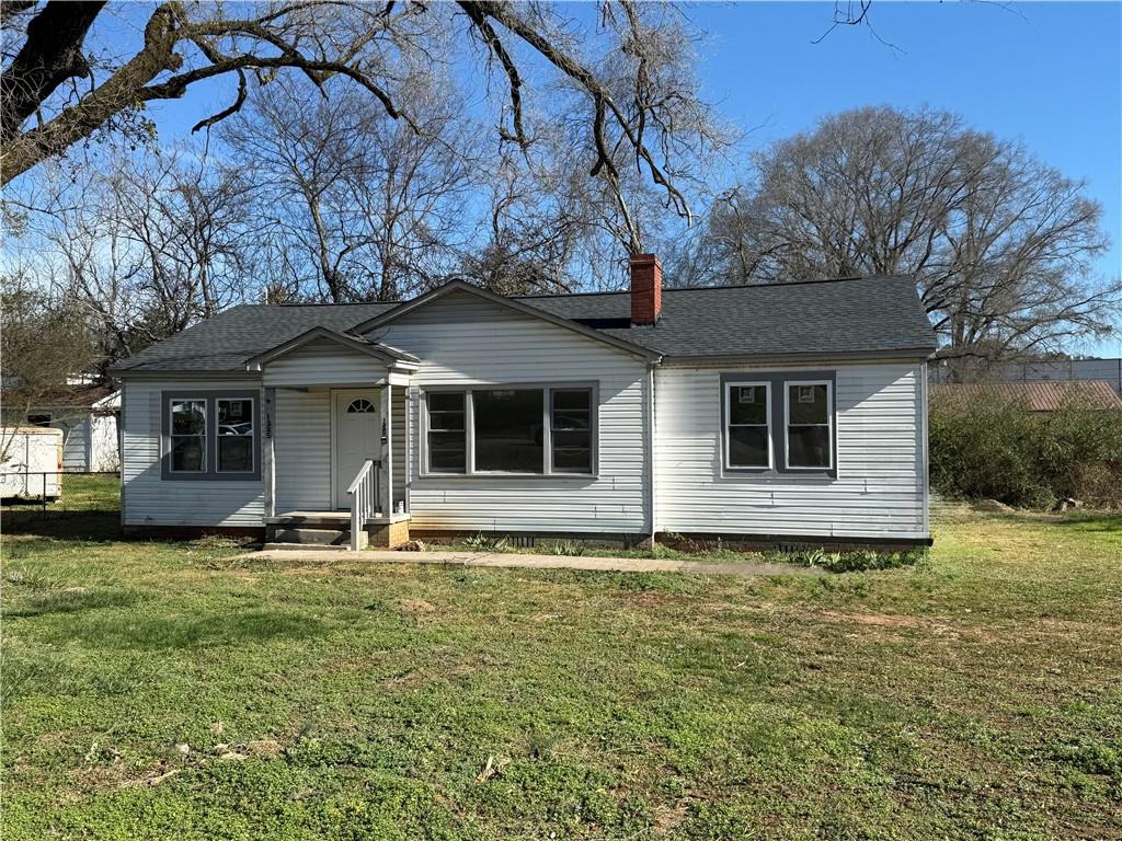 1325 Highway 41 Calhoun, GA 30701 - Photo 1 of 19 a front view of a house with a yard