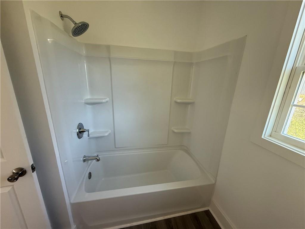 1325 Highway 41 Calhoun, GA 30701 - Photo 12 of 19 a bathroom with a tub and shower