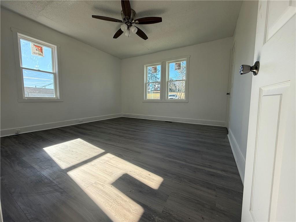 1325 Highway 41 Calhoun, GA 30701 - Photo 16 of 19 a view of an empty room with wooden floor and a window