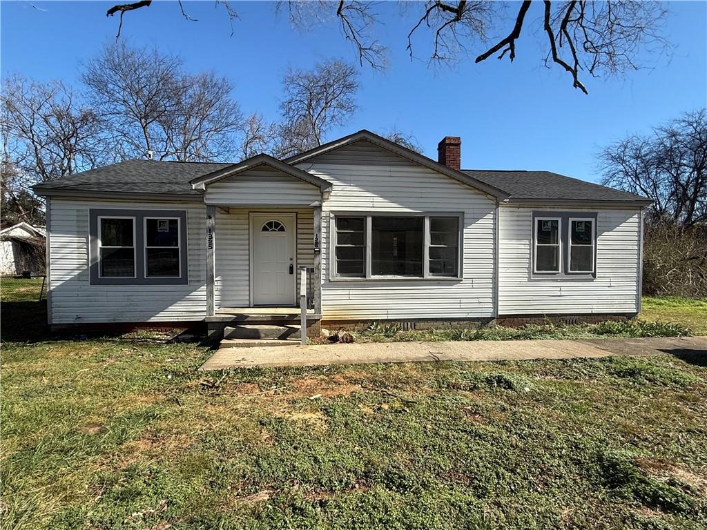 1325 Highway 41 Calhoun, GA 30701 - Photo 2 of 19 a front view of a house with a yard