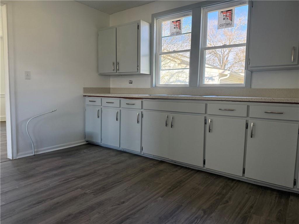 1325 Highway 41 Calhoun, GA 30701 - Photo 7 of 19 a kitchen with granite countertop wooden cabinets a sink and a window