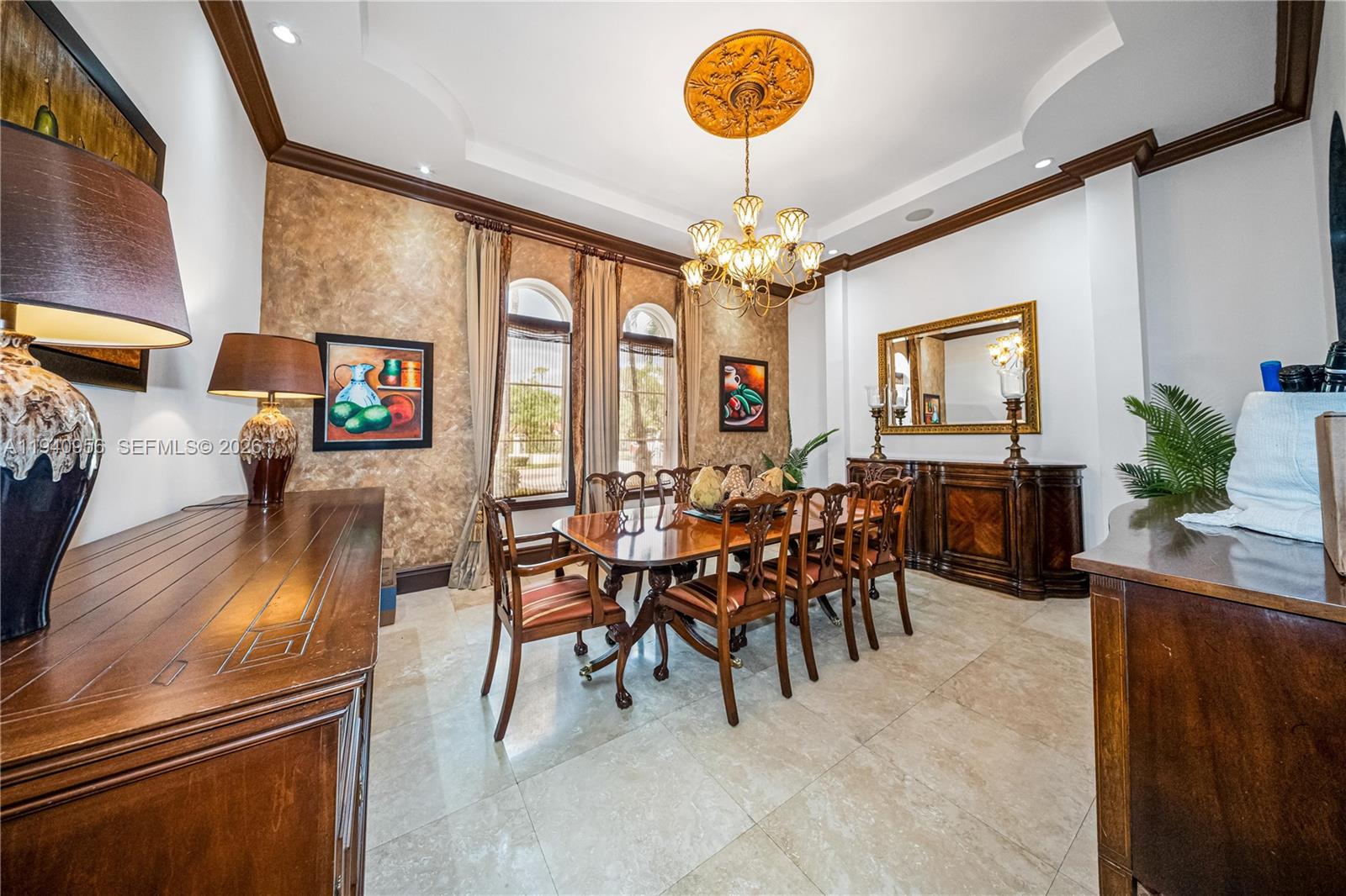 7538 Southwest 64th Street Miami, FL 33143 - Photo 24 of 78 a view of a dining room with furniture a chandelier and a large window