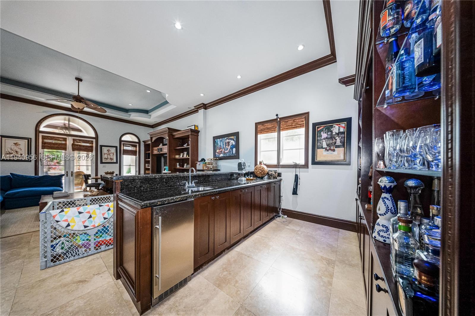 7538 Southwest 64th Street Miami, FL 33143 - Photo 25 of 78 a kitchen with stainless steel appliances granite countertop a stove and cabinets
