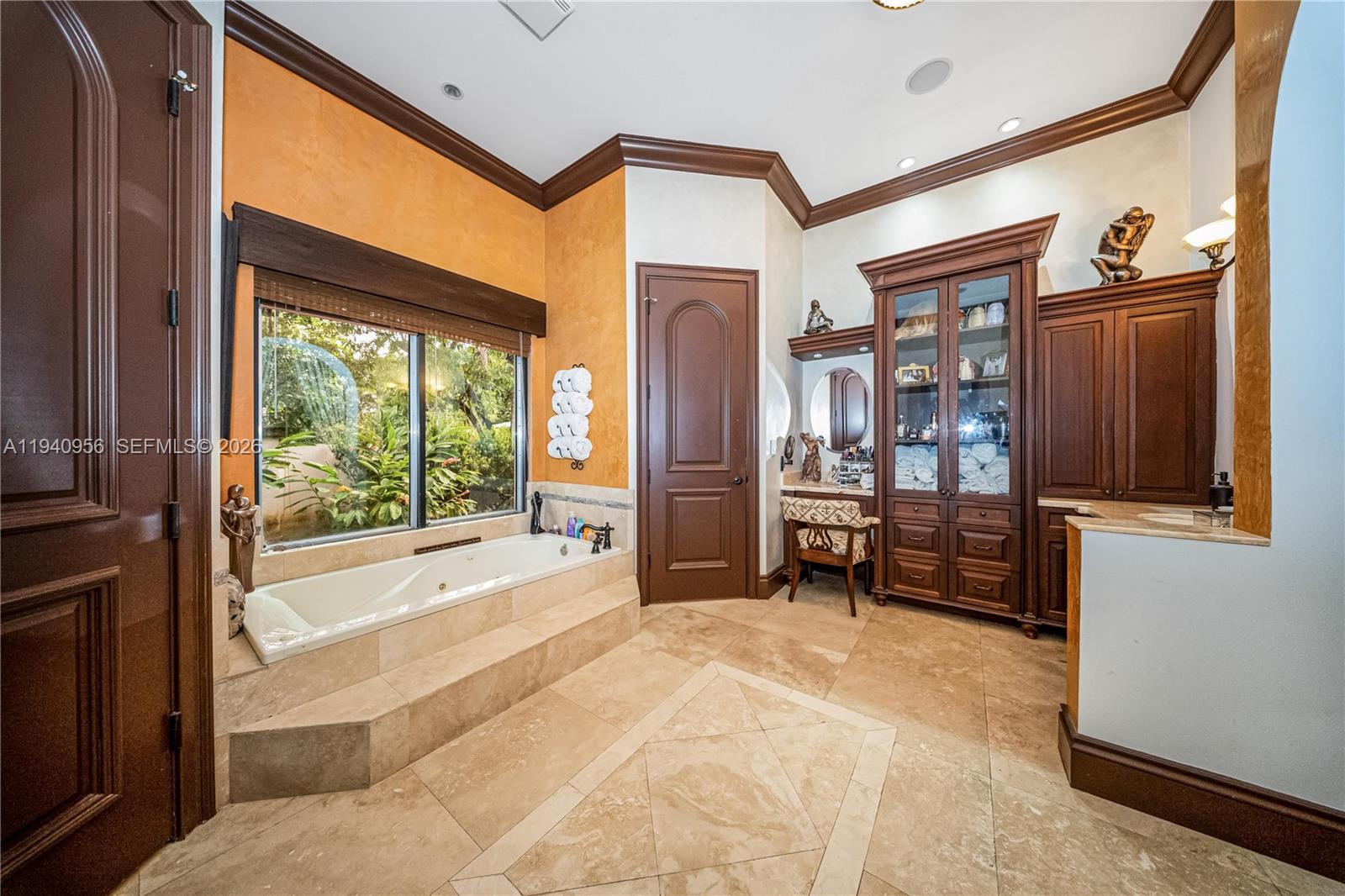 7538 Southwest 64th Street Miami, FL 33143 - Photo 33 of 78 a spacious bedroom with a large bed and a dresser