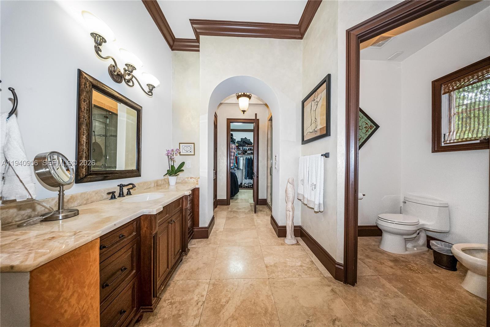 7538 Southwest 64th Street Miami, FL 33143 - Photo 35 of 78 a spacious bathroom with a double vanity sink and a mirror