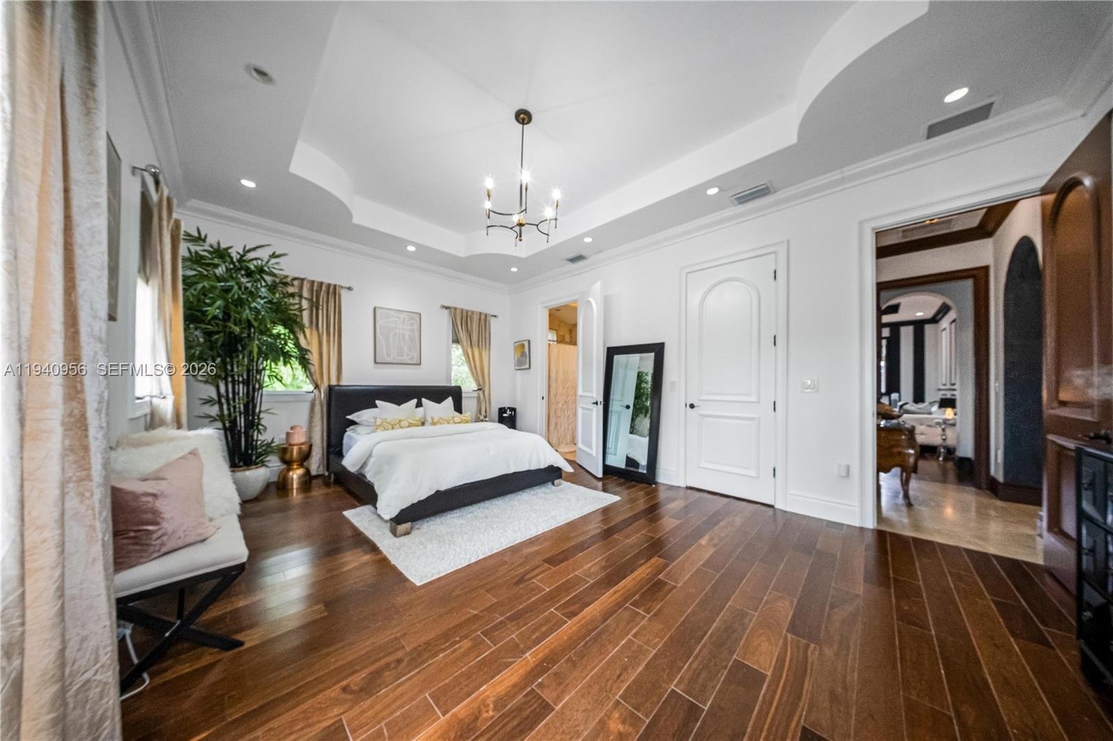 7538 Southwest 64th Street Miami, FL 33143 - Photo 40 of 78 a living room with furniture and a chandelier