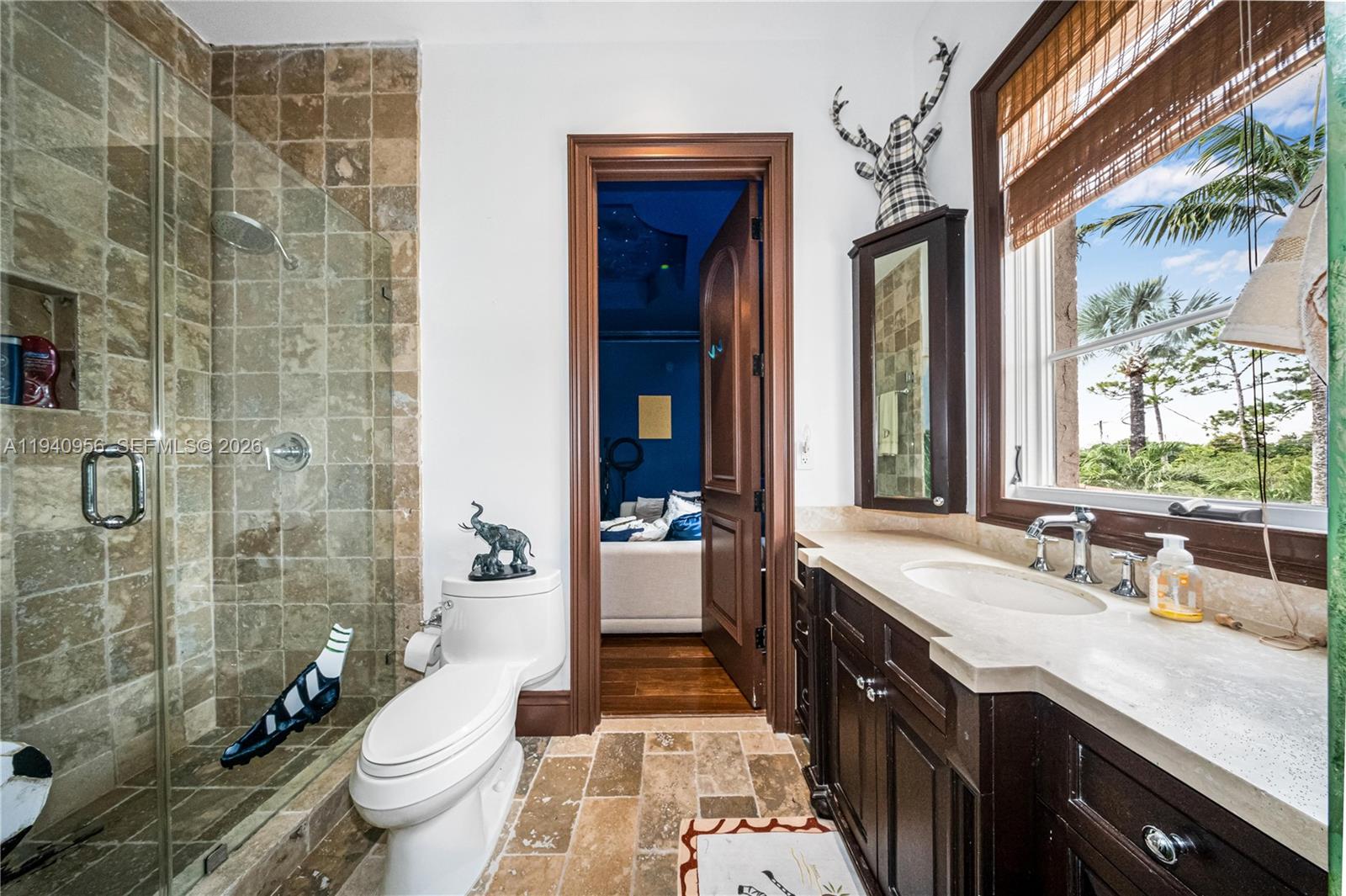 7538 Southwest 64th Street Miami, FL 33143 - Photo 48 of 78 a spacious bathroom with a double vanity sink toilet mirror and shower
