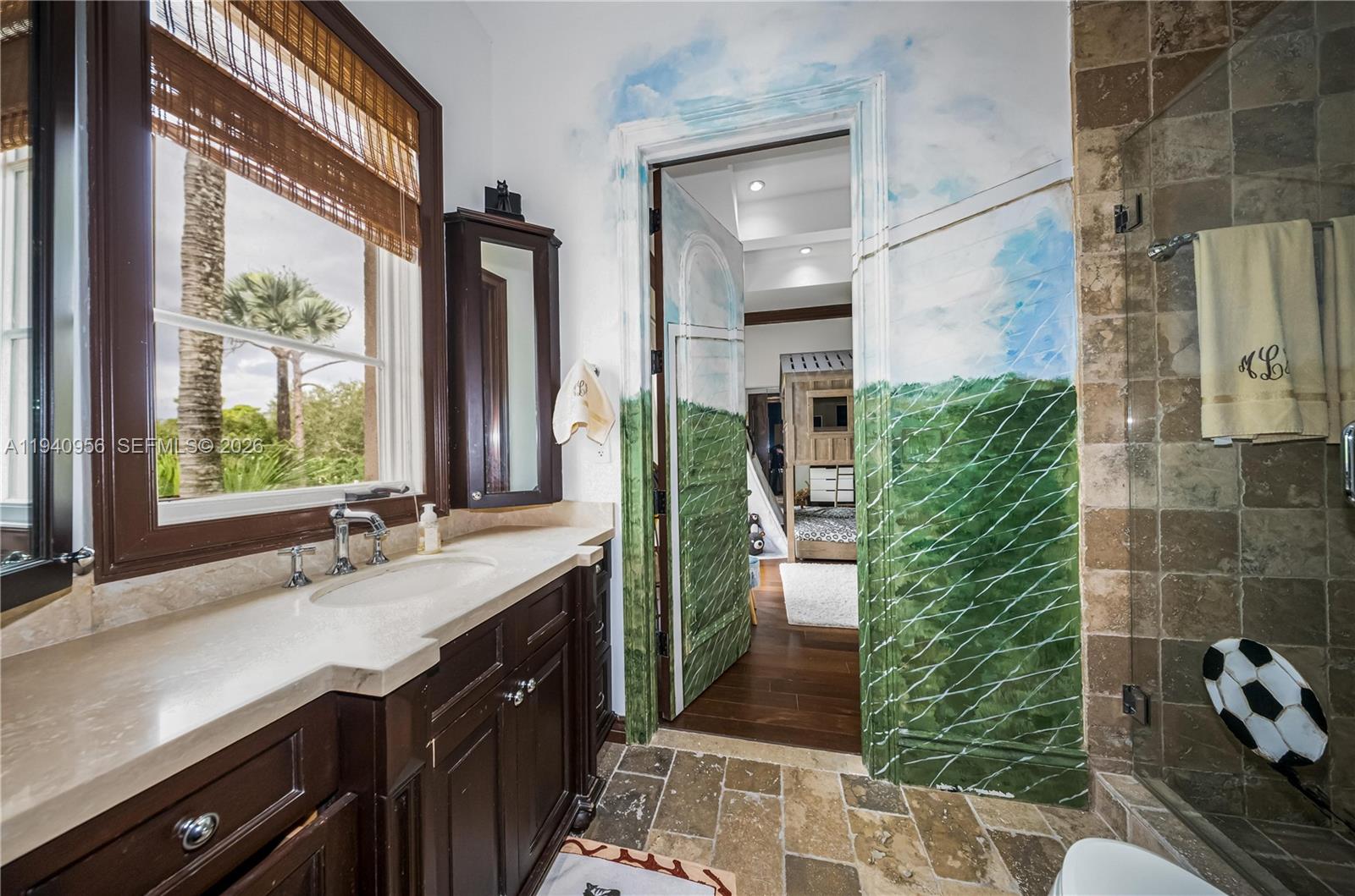 7538 Southwest 64th Street Miami, FL 33143 - Photo 49 of 78 a bathroom with a double vanity sink and a mirror