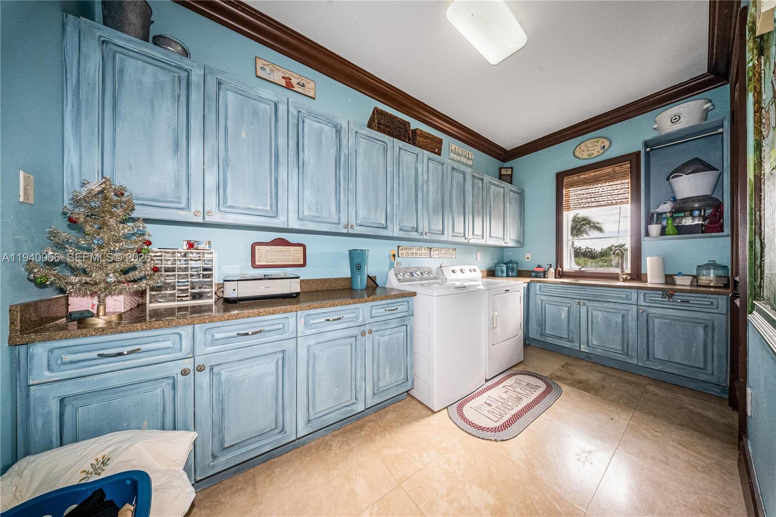 7538 Southwest 64th Street Miami, FL 33143 - Photo 53 of 78 a kitchen with granite countertop a stove a sink dishwasher and cabinets with wooden floor