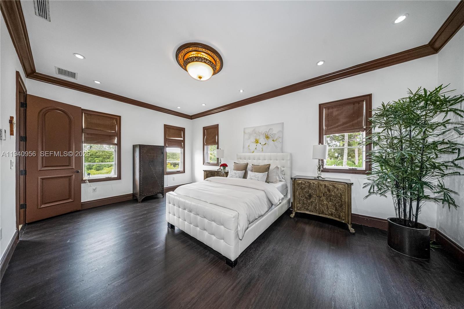7538 Southwest 64th Street Miami, FL 33143 - Photo 59 of 78 a spacious bedroom with a large bed and a large window