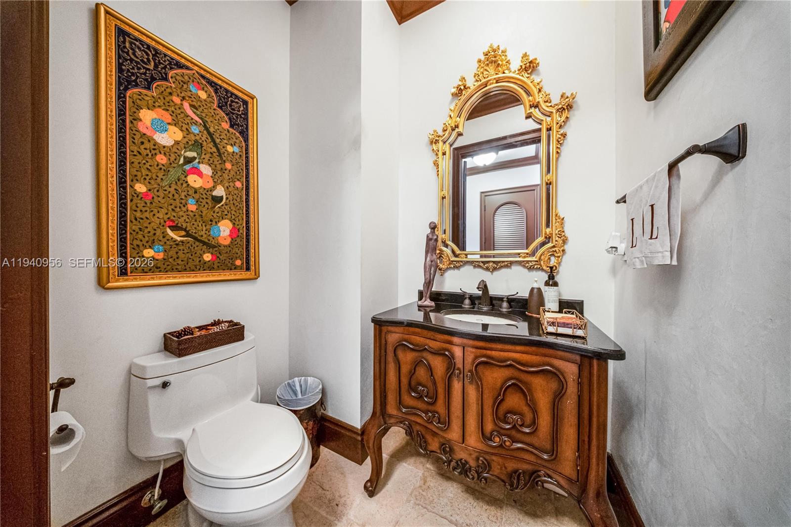 7538 Southwest 64th Street Miami, FL 33143 - Photo 61 of 78 a bathroom with a toilet a sink and mirror